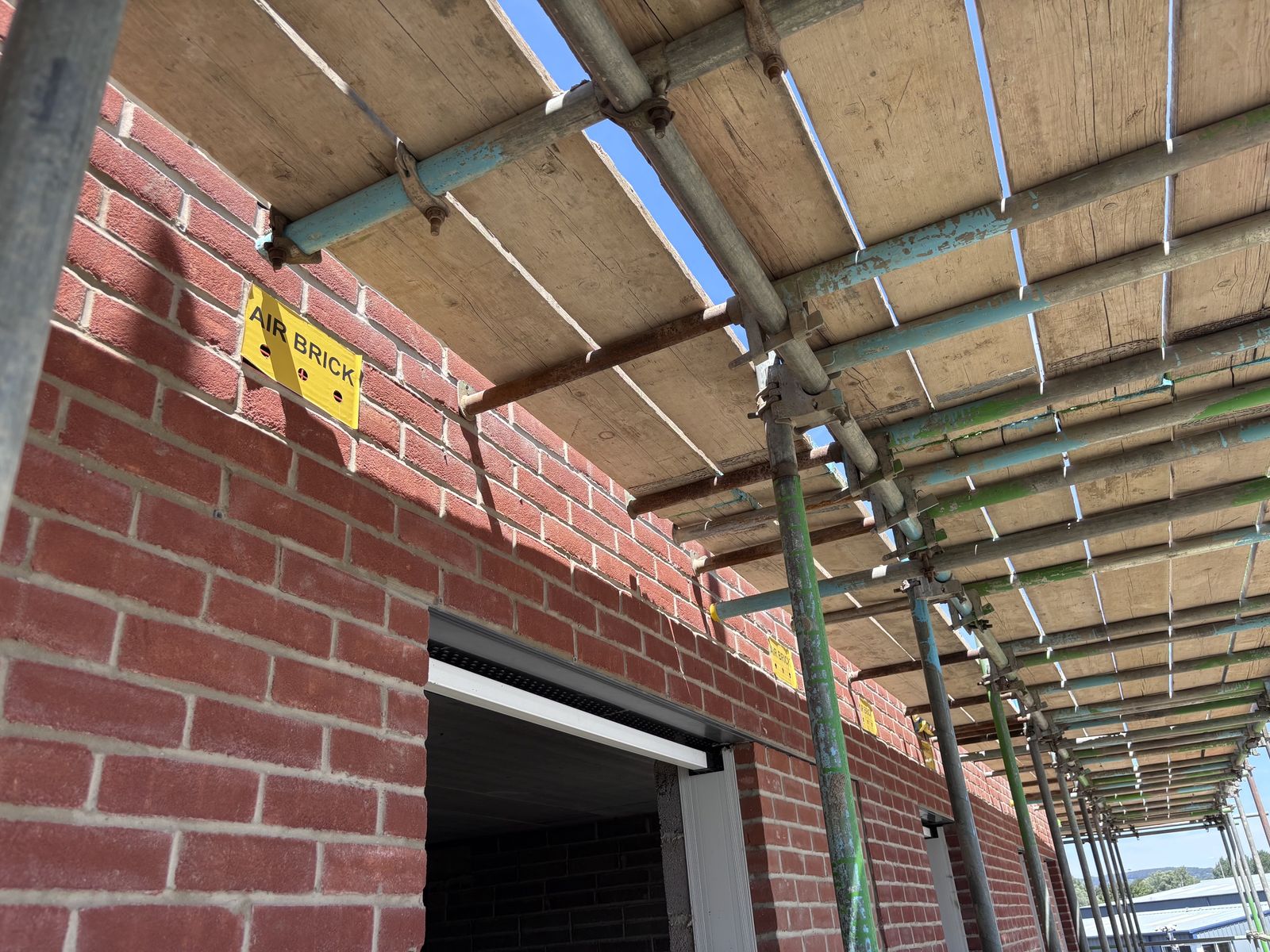 External brickwork under scaffolding at the Chichester development