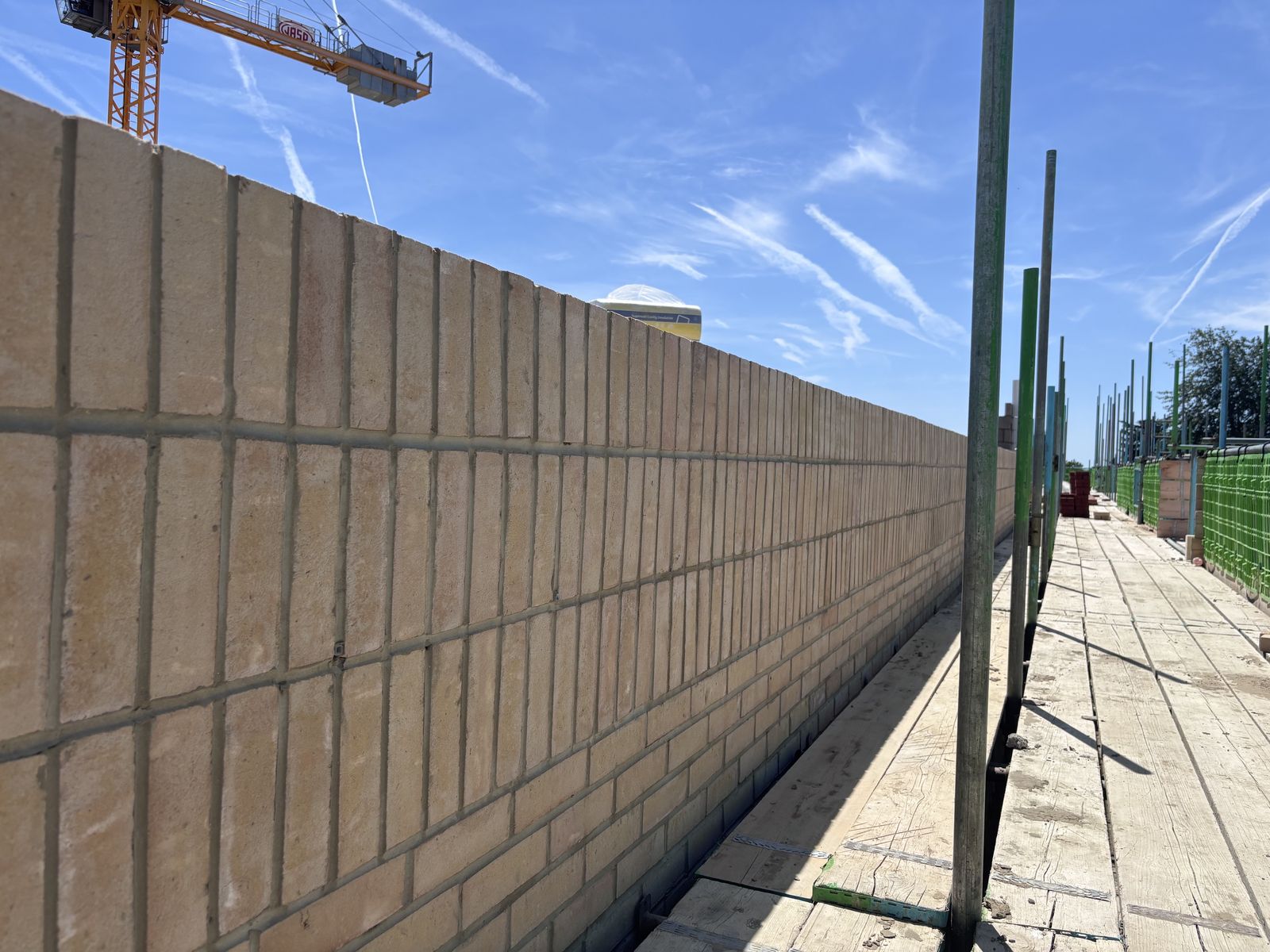 Long blockwork wall under construction at the Chichester development