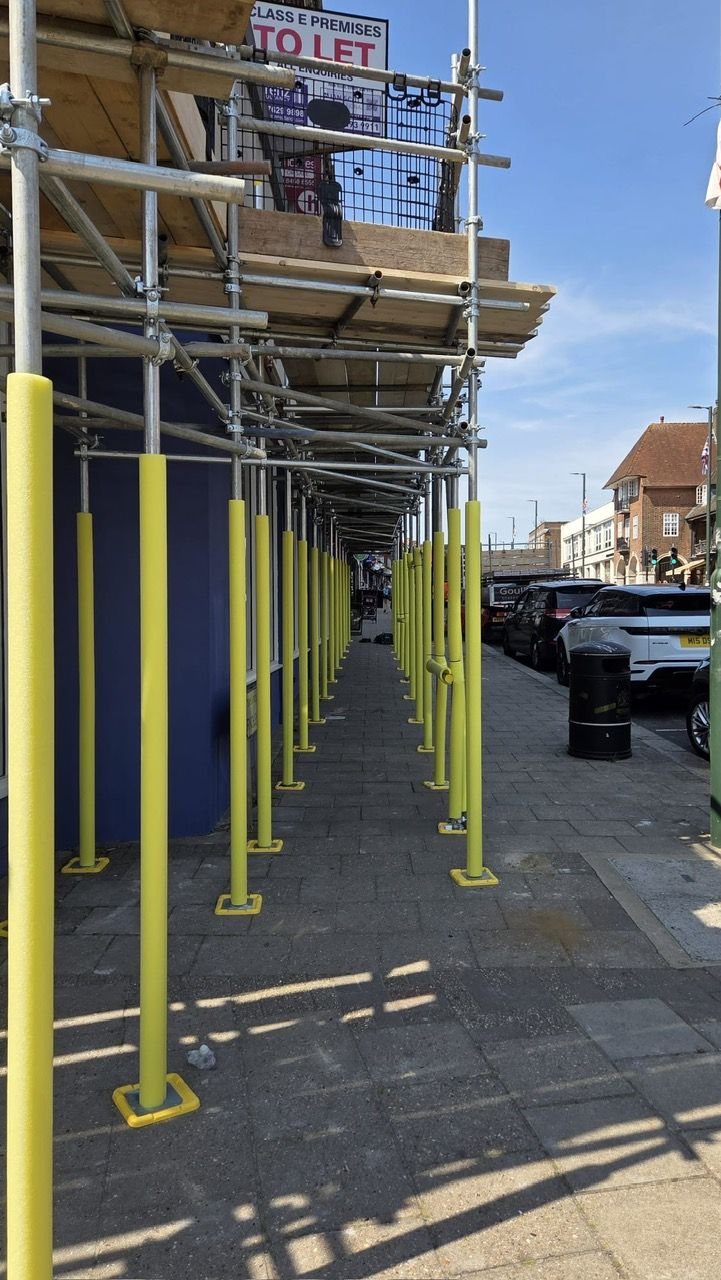 Protected pedestrian walkway beneath GoulPar scaffolding in North London