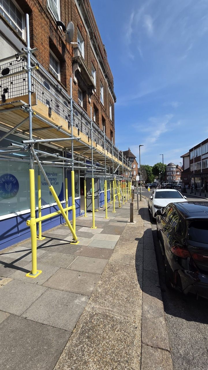 Pavement scaffold and protected walkway along a North London street