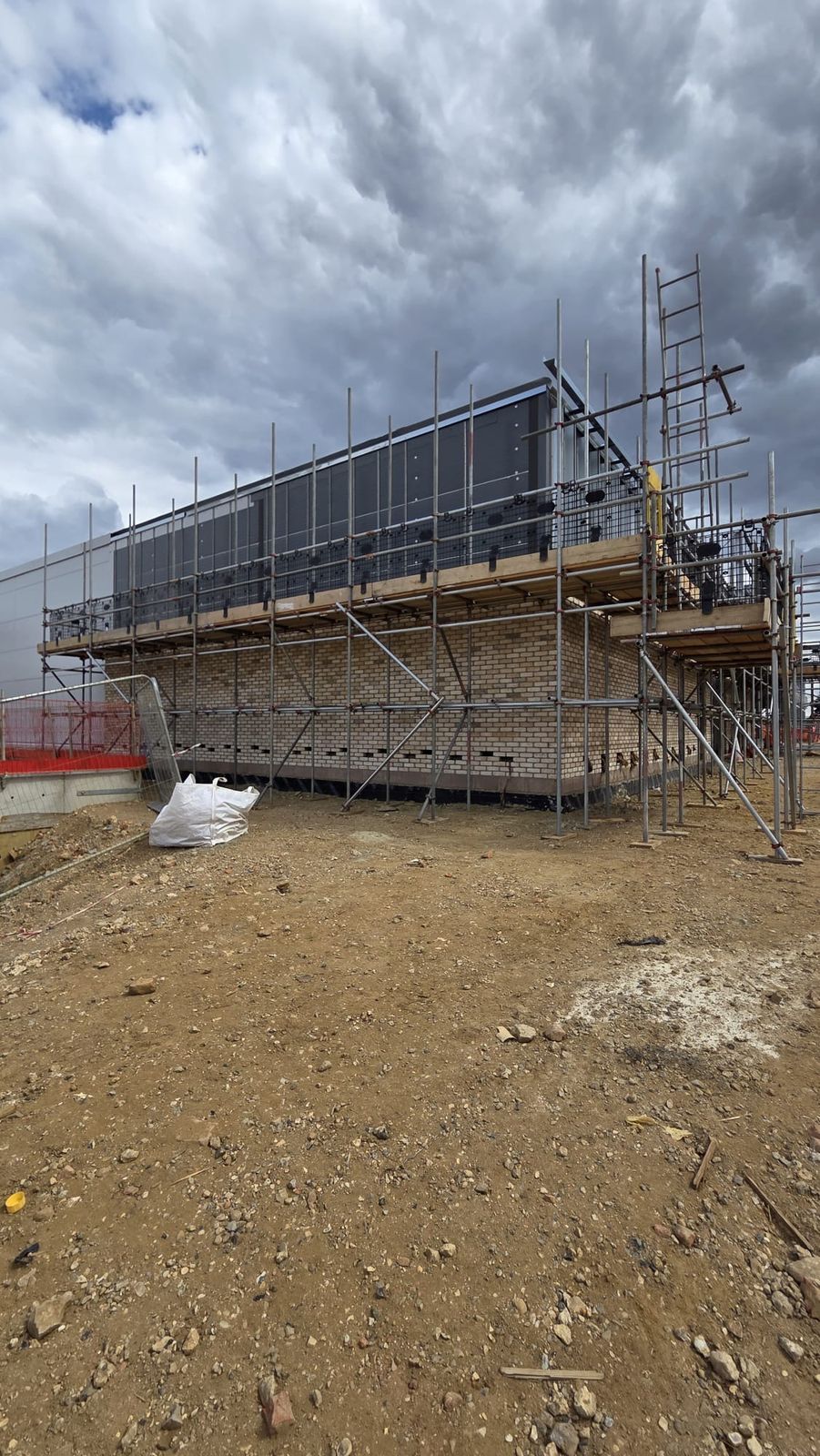 Scaffolded brick elevation at the Sainsbury's shopping centre project