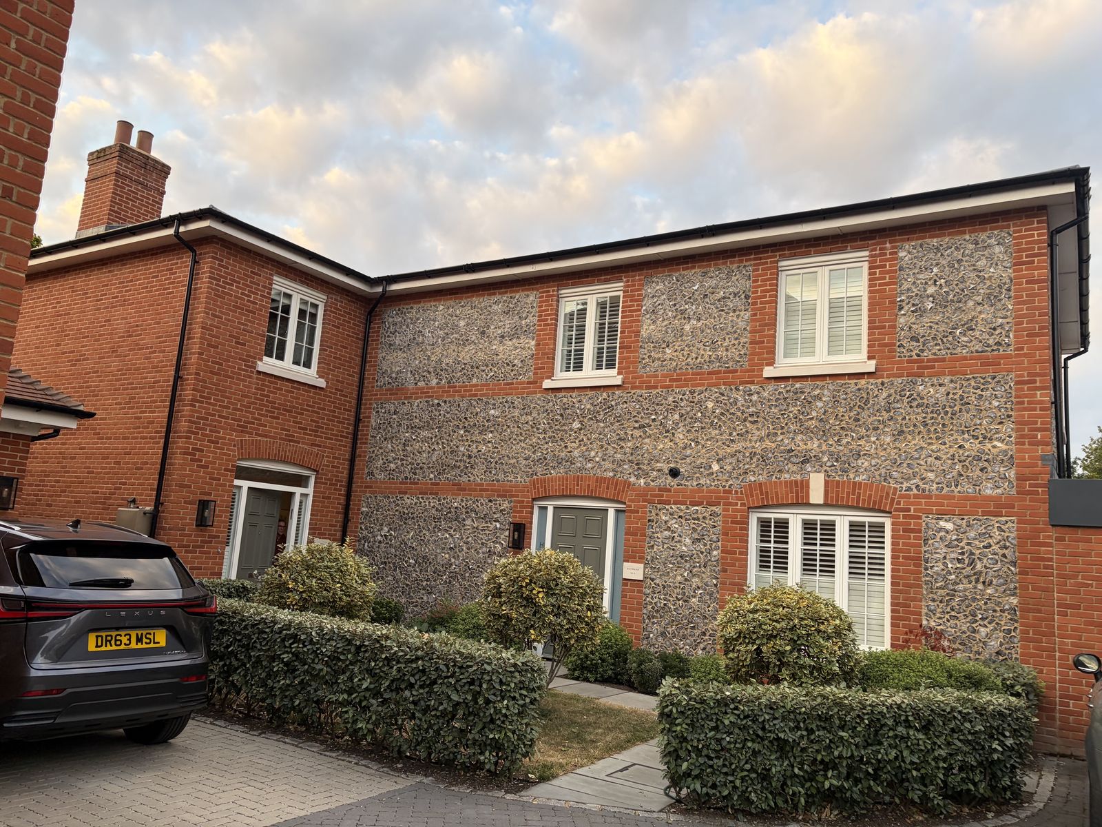 Knapped flint and red-brick elevation at the St Cross Road development