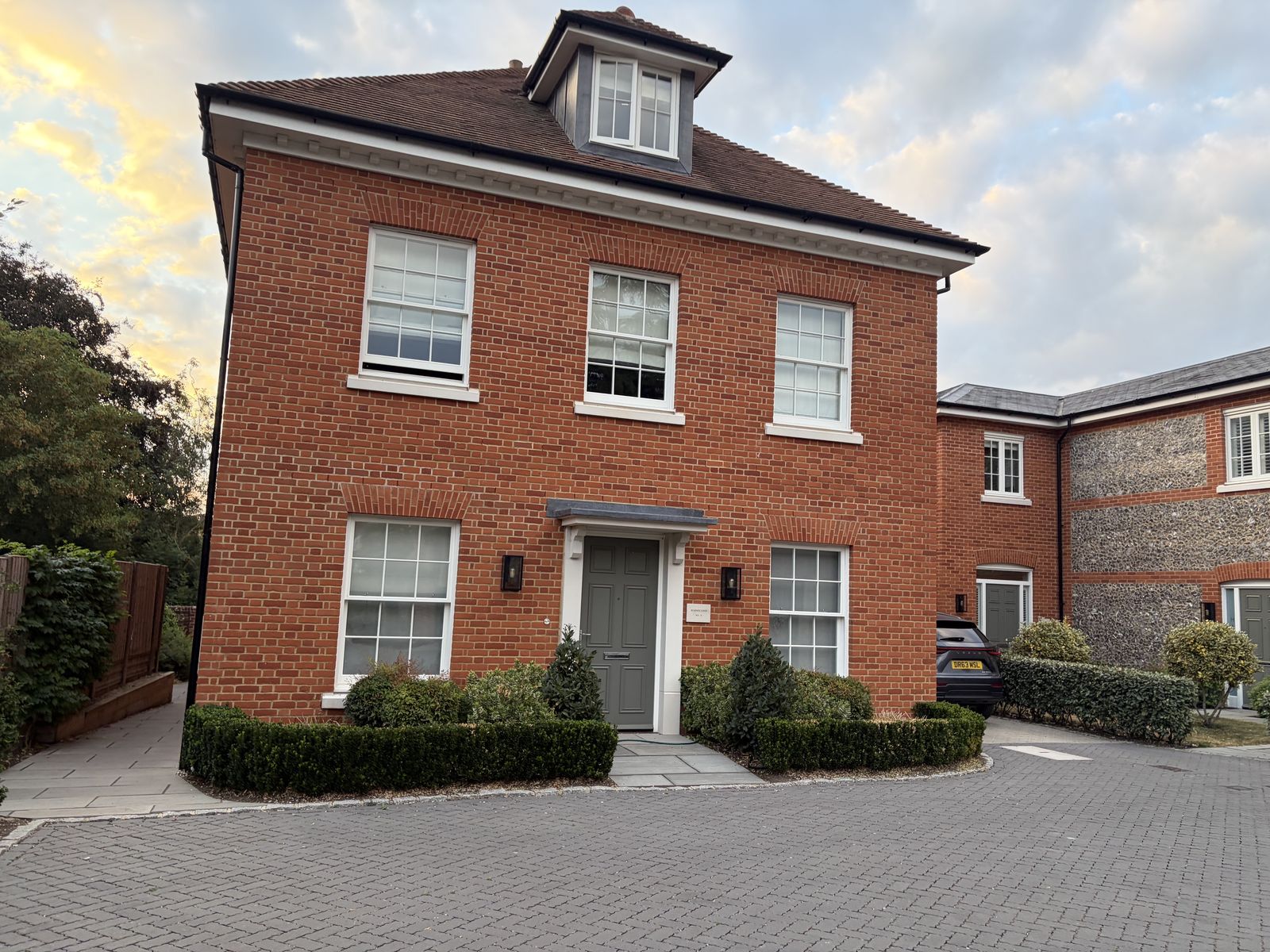 Red-brick house with dormer at the St Cross Road development