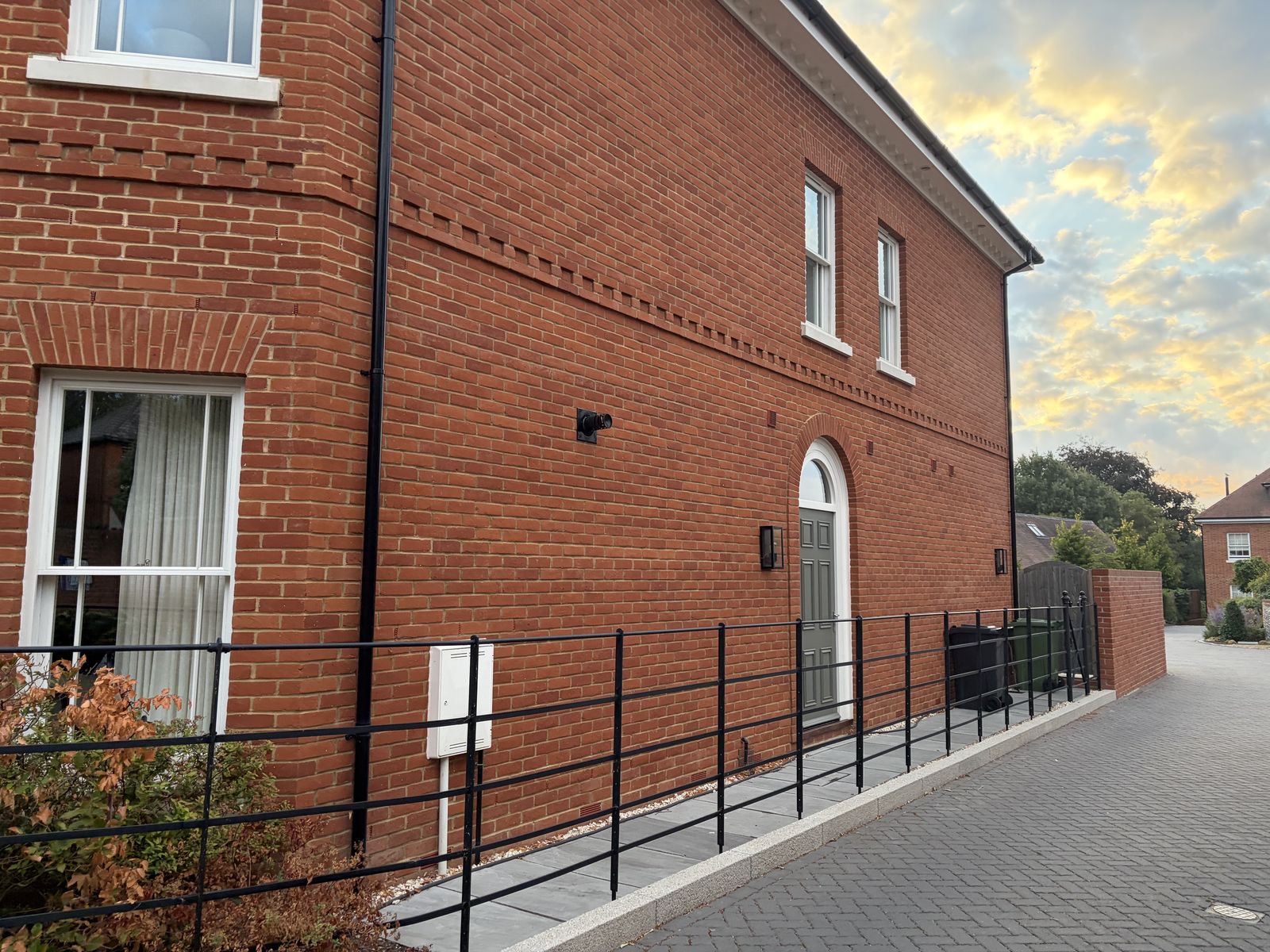 Red-brick elevation with protruding feature bands at the St Cross Road development