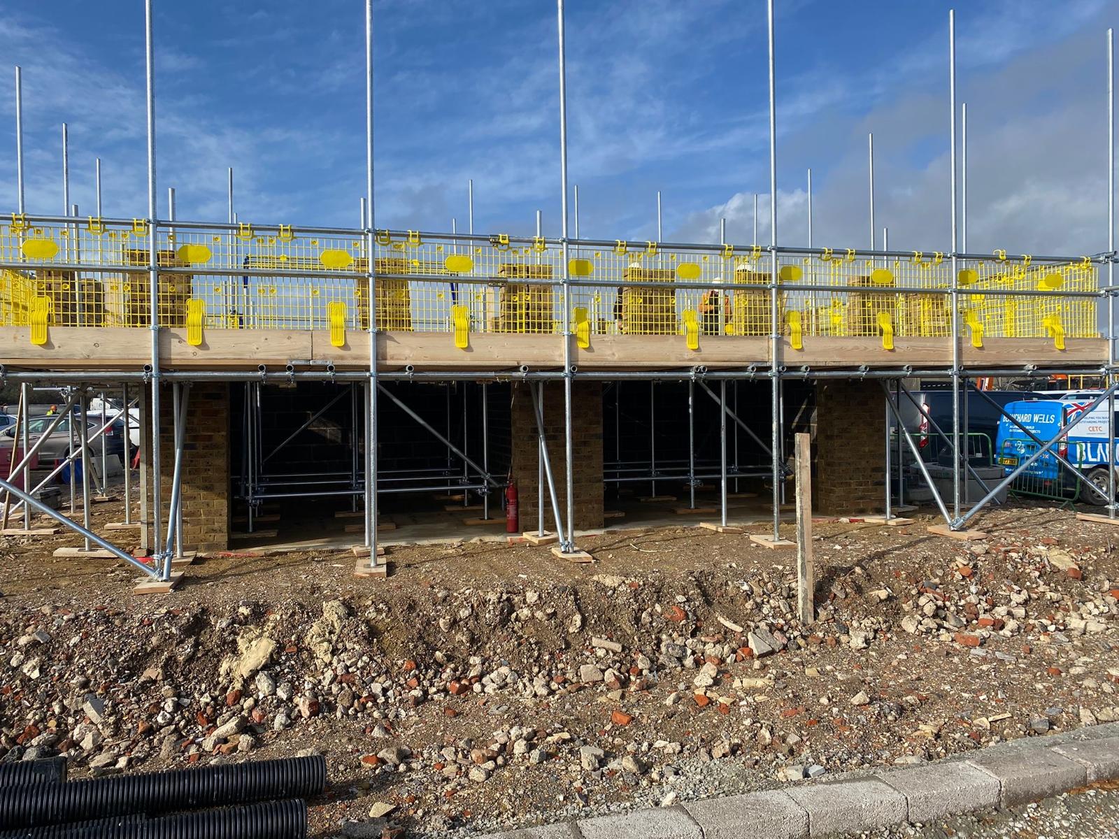 Tipner East scaffold + brickwork mid-build