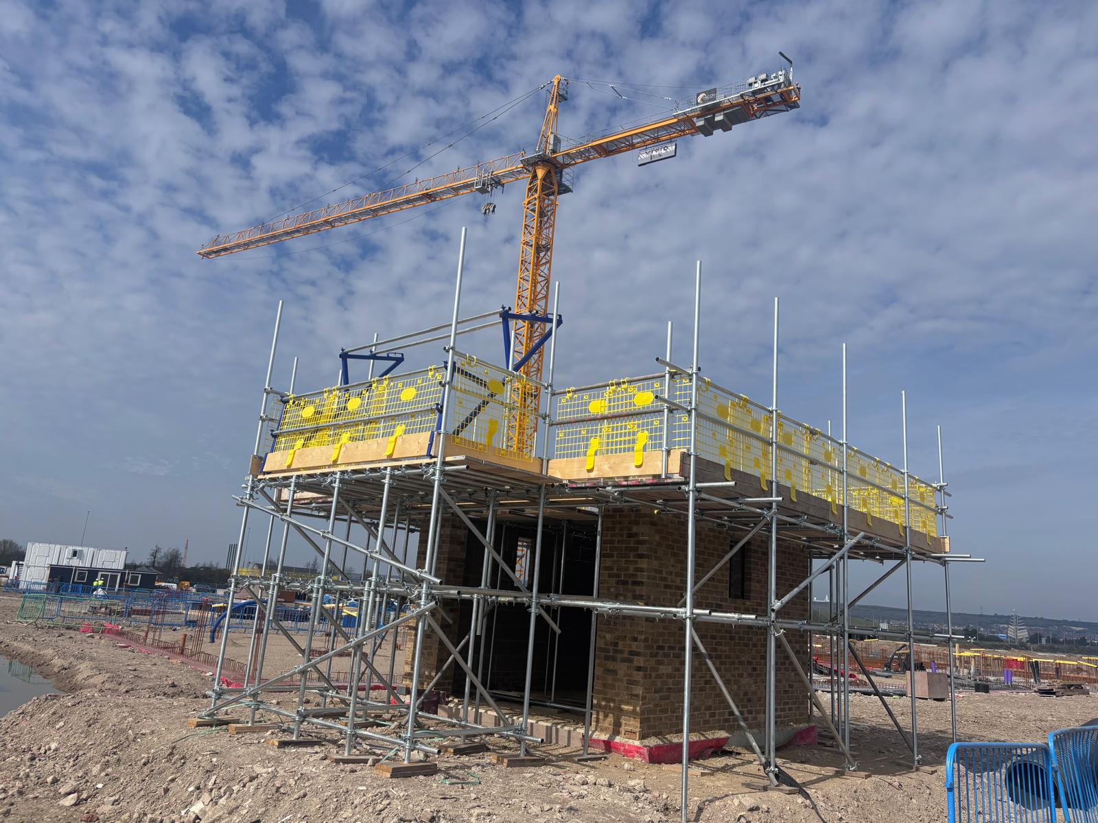 Tipner East scaffold platforms with tower crane