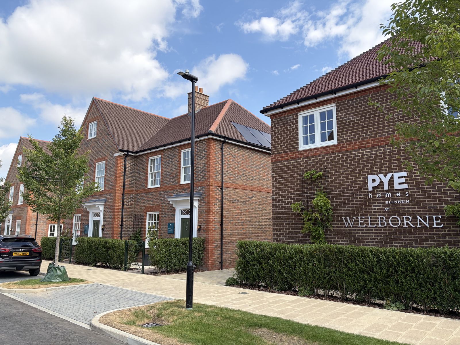 Welbourne Village entrance and PYE Homes branding