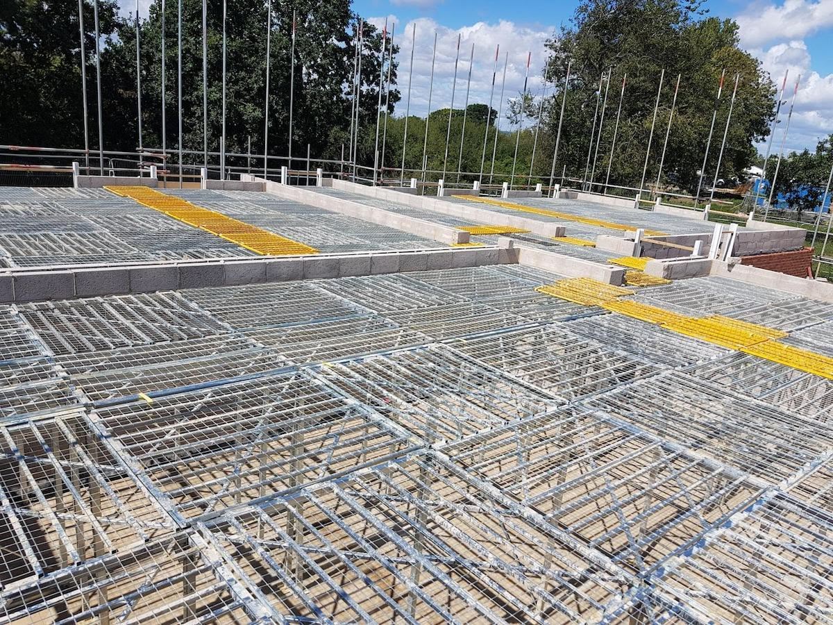 Whitehill Chase drone aerial — scaffold and platforms across the scheme